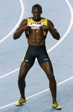File photo shows Usain Bolt of Jamaica dancing as he celebrates winning the mens 4x100 metres relay final in Daegu