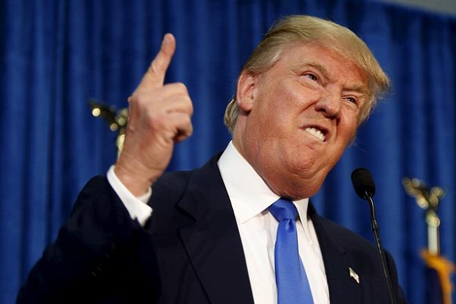 Republican presidential candidate Trump gestures and declares "Youre fired!" at a rally in Manchester