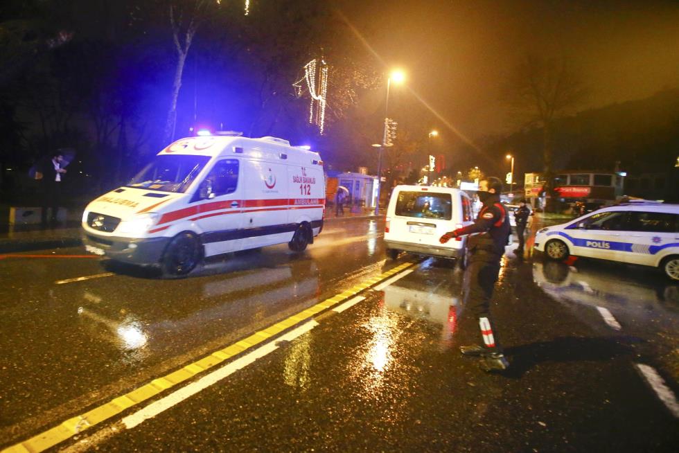 An ambulance arrives near a nightclub where a gun attack took place during a New Year party in Istanbul