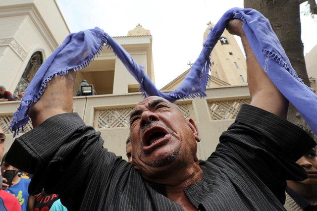 A relative of one of the victims reacts after a church explosion killed at least 21 in Tanta