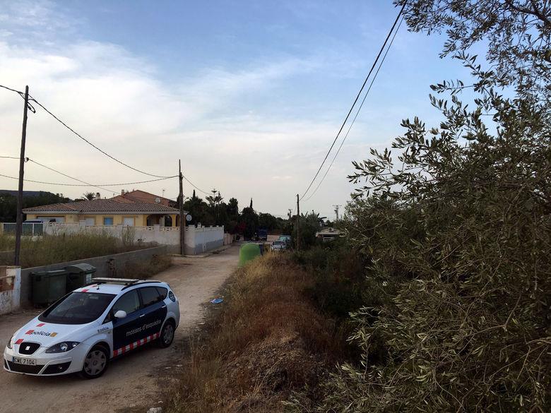 A car belonging to the Catalan Mossos dEsquadra is parked next a house which was razed by an explosion when suspected jihadists used gas canisters shortly before midnight on Wednesday in Alcanar