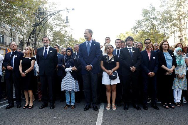 Spains King Felipe, PM Rajoy and Catalan regional president Puigdemont take part in a march of unity after the attacks last week, in Barcelona, Spain