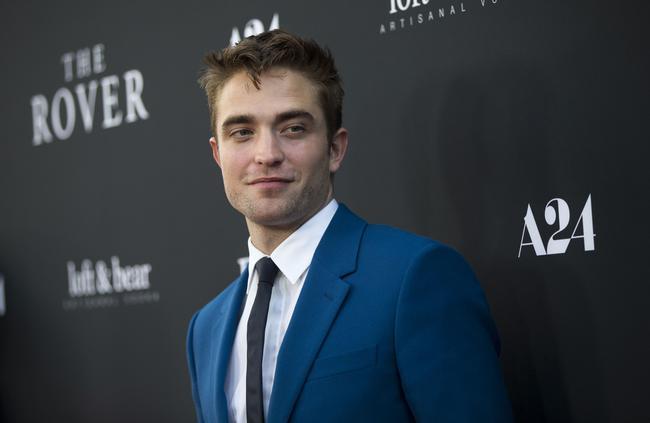 Cast member Pattinson poses at the premiere of "The Rover" in Los Angeles