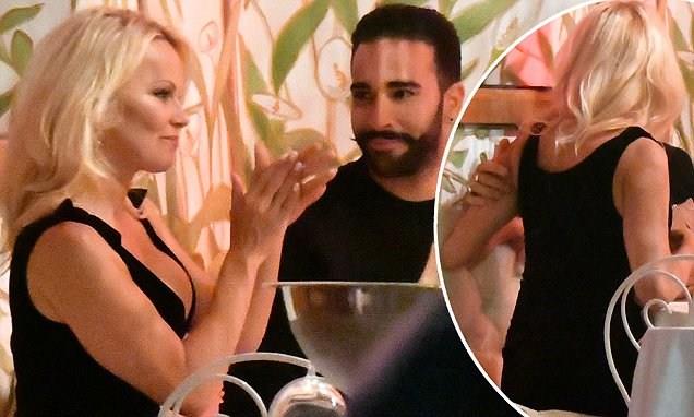 Pamela Anderson and her boyfriend Adil Ramy enjoyed a romantic dinner with champagne in the VIP section of La Gioa restaurant in St. Tropez.