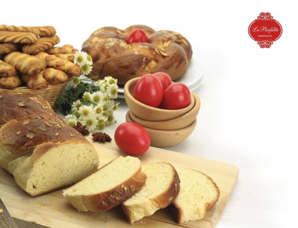 Easter sweet bread with red eggs and shortbread cookies