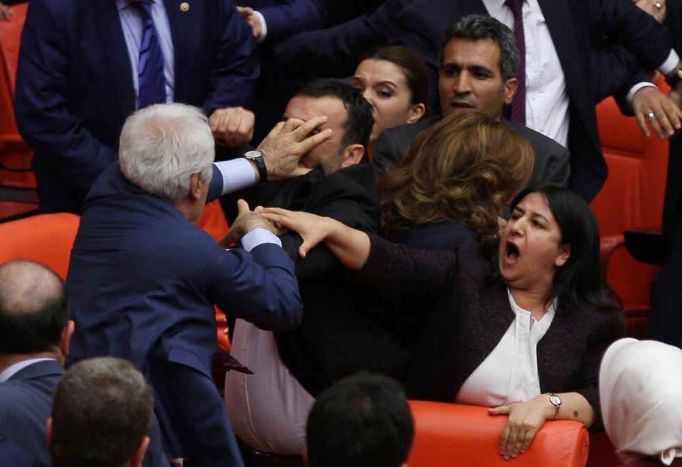 Ruling AK Party and pro-Kurdish Peoples Democratic Party (HDP) lawmakers scuffle during a debate at the Parliament in Ankara
