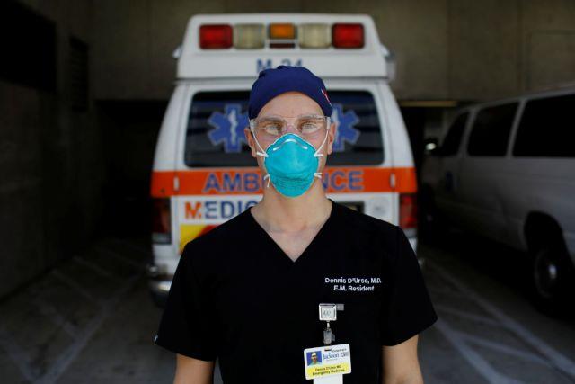 Dennis DUrso, a resident ER doctor at Jackson Memorial Hospital, poses for a photo during his shift amid an outbreak of the coronavirus disease (COVID-19), in Miami